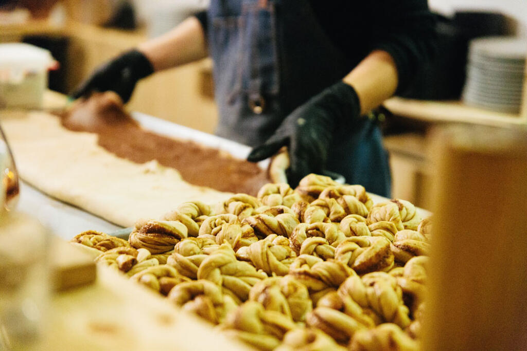 Baking Cinammon Rolls at Gregory''s Foods | Wholesale bake goods